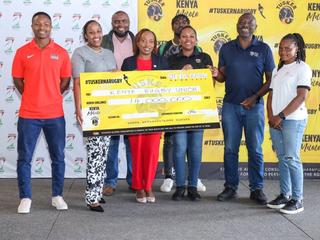 Shujaa and Lionesses captain pose for a photo with the KRU board and Tusker