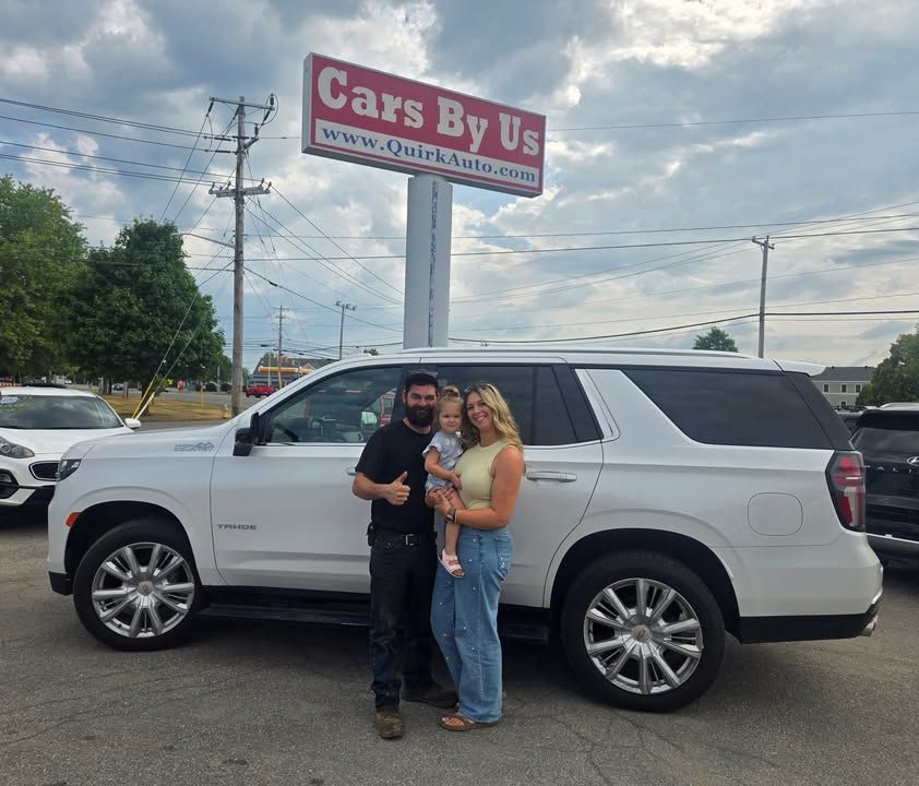 Alex and his family with their 2021 Chevrolet Tahoe High Country