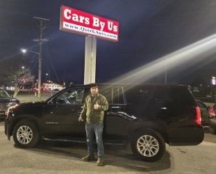 Devin with their GMC Yukon XL SLT