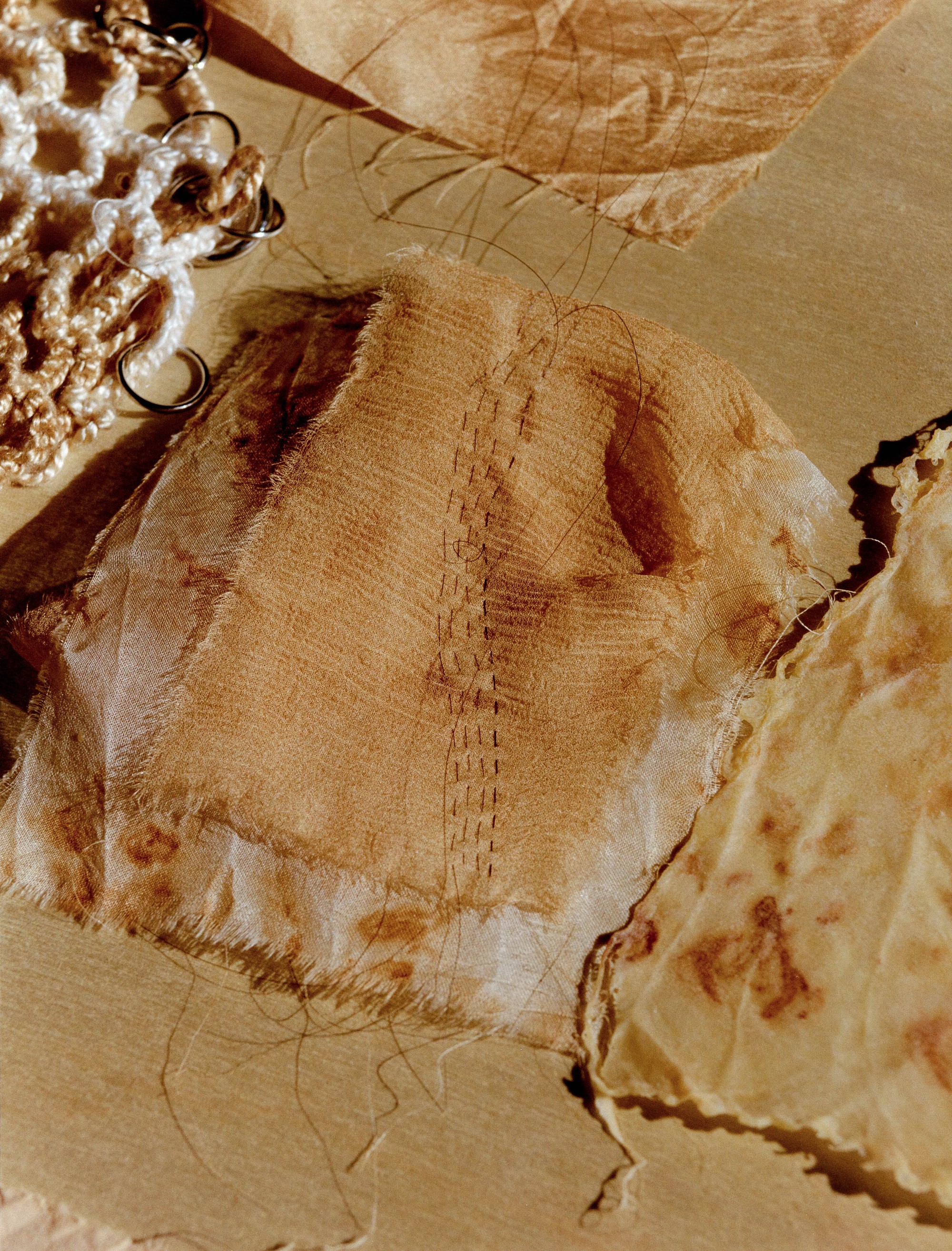 Close detail of naturally dyed and hand-stitched fabric by Portland artist Laura Kung, medium format film photograph