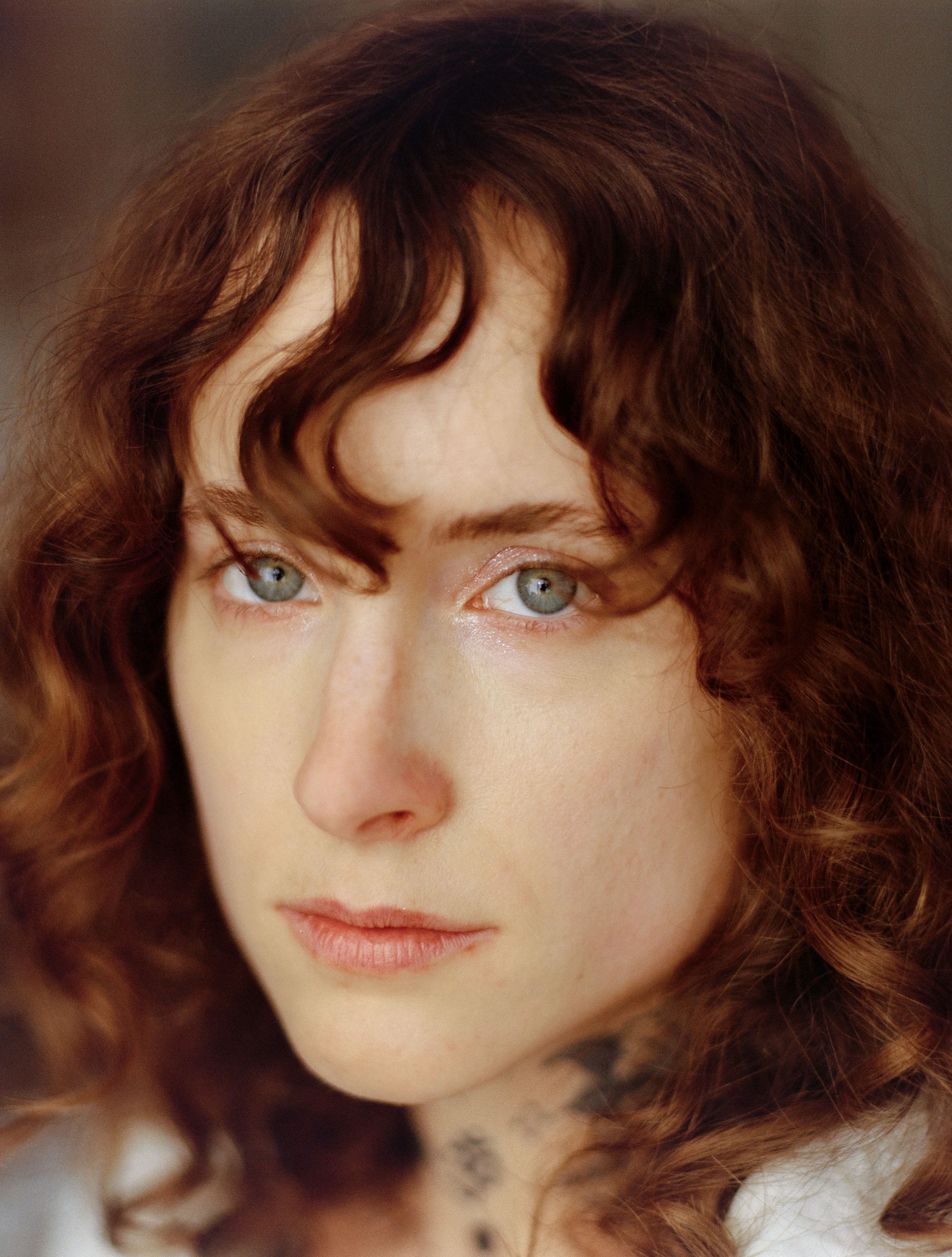 Tight close-up portrait of Addeline Griswold, artist known as Burger Babie, shot on medium format film in Los Angeles by Nathaniel Perales