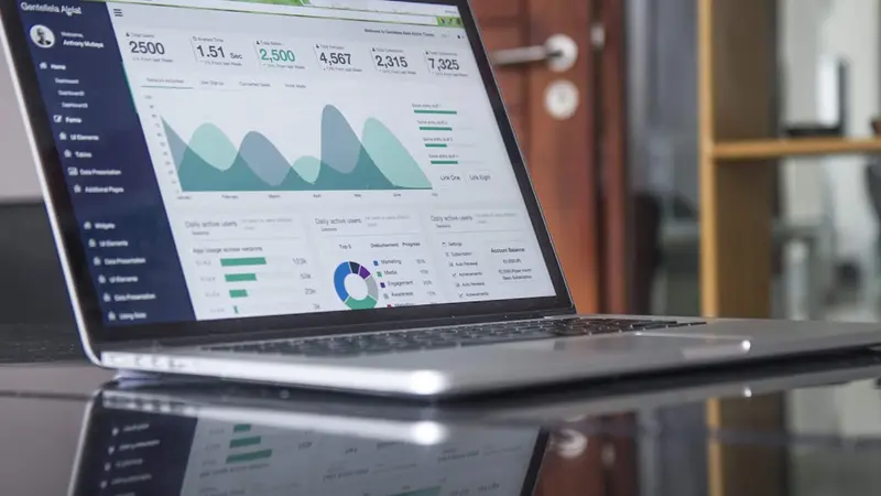 Developer workspace with code on monitors - no-code development