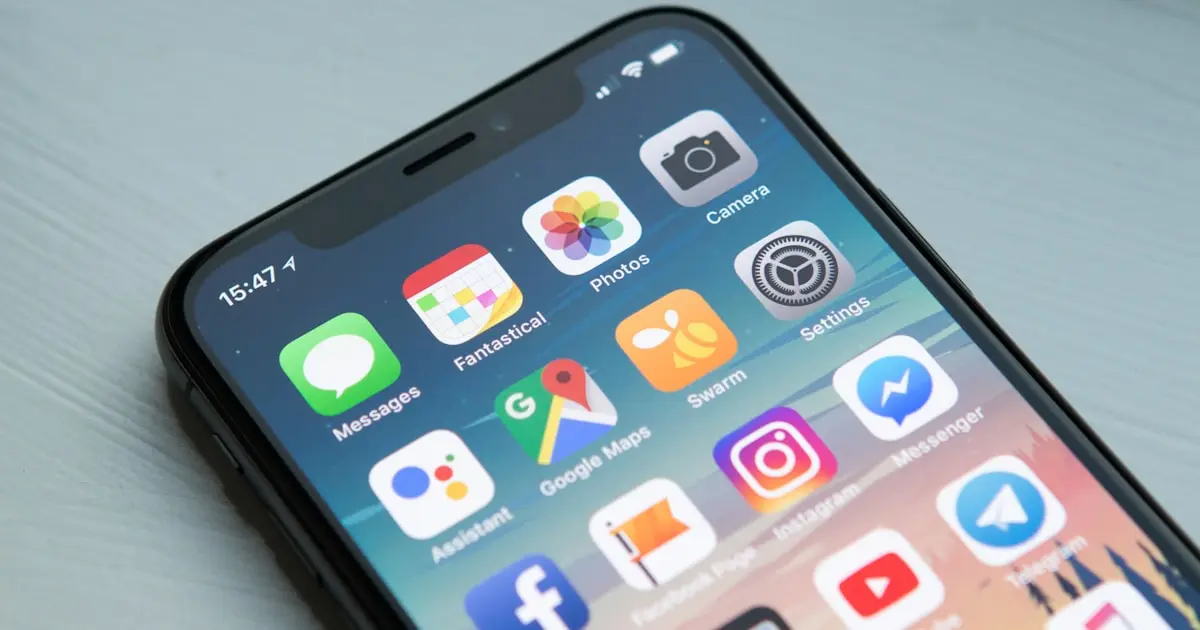 Mobile app development with code on laptop screen