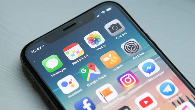 Mobile app development with code on laptop screen