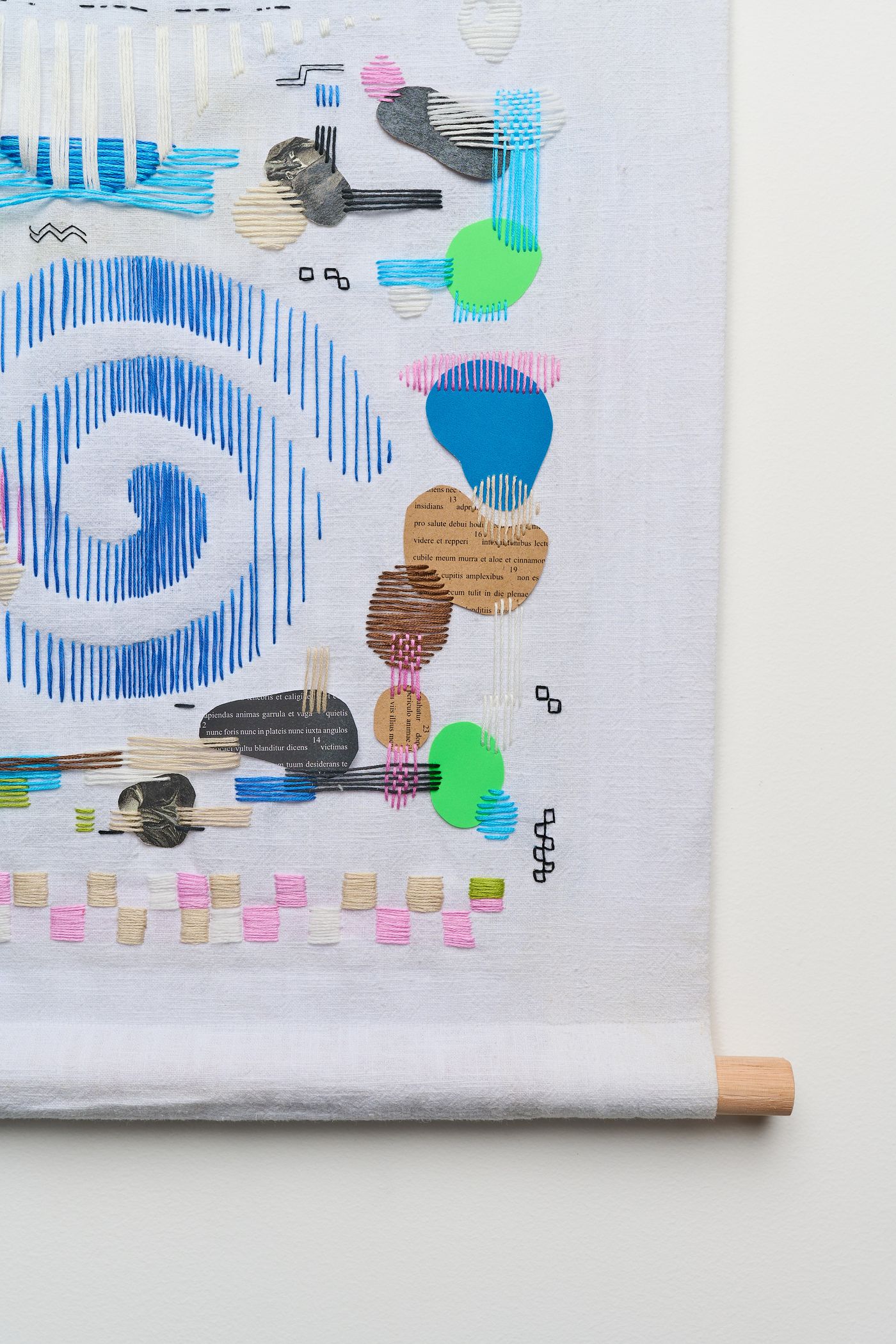 Pt 1 detail — spiral and stitched paper fragments