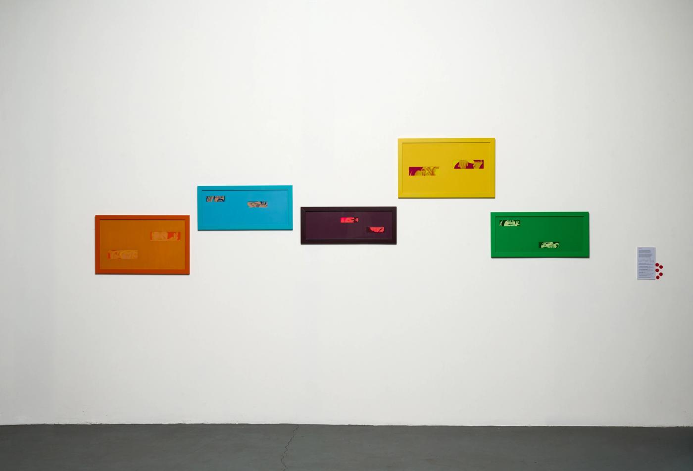 Installation view — the five frames staggered across a white wall