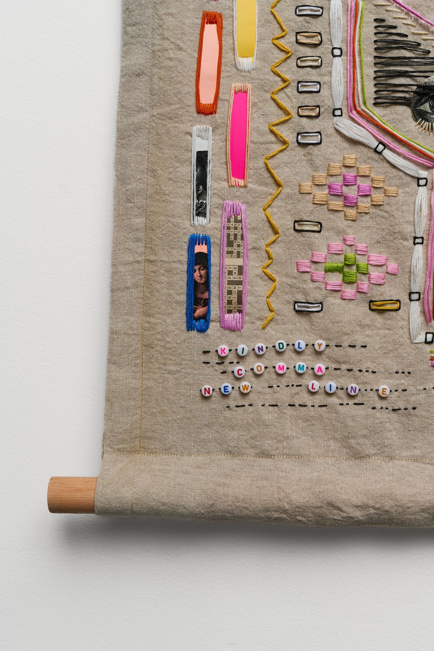Pt 2 detail — alphabet beads spelling “KINDLY COMMA NEW LINE”