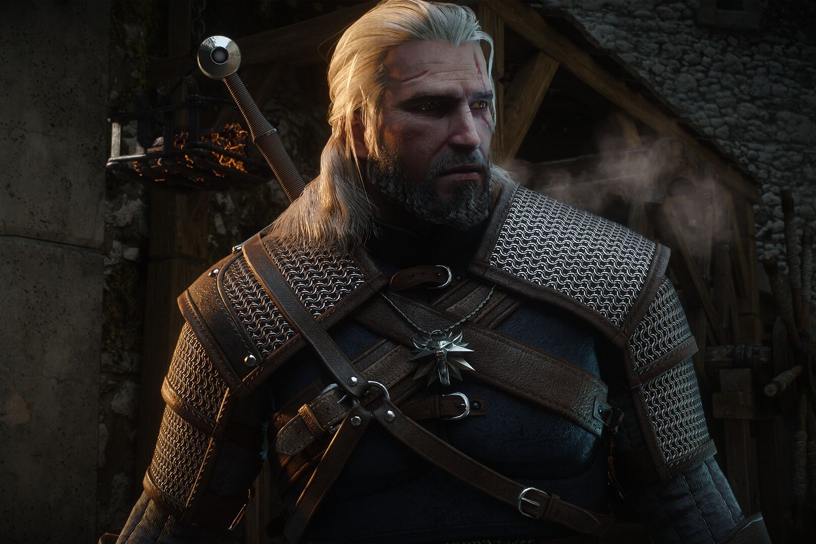 Geralt of Rivia in a chainmail and leather armour set standing in a stone village street
