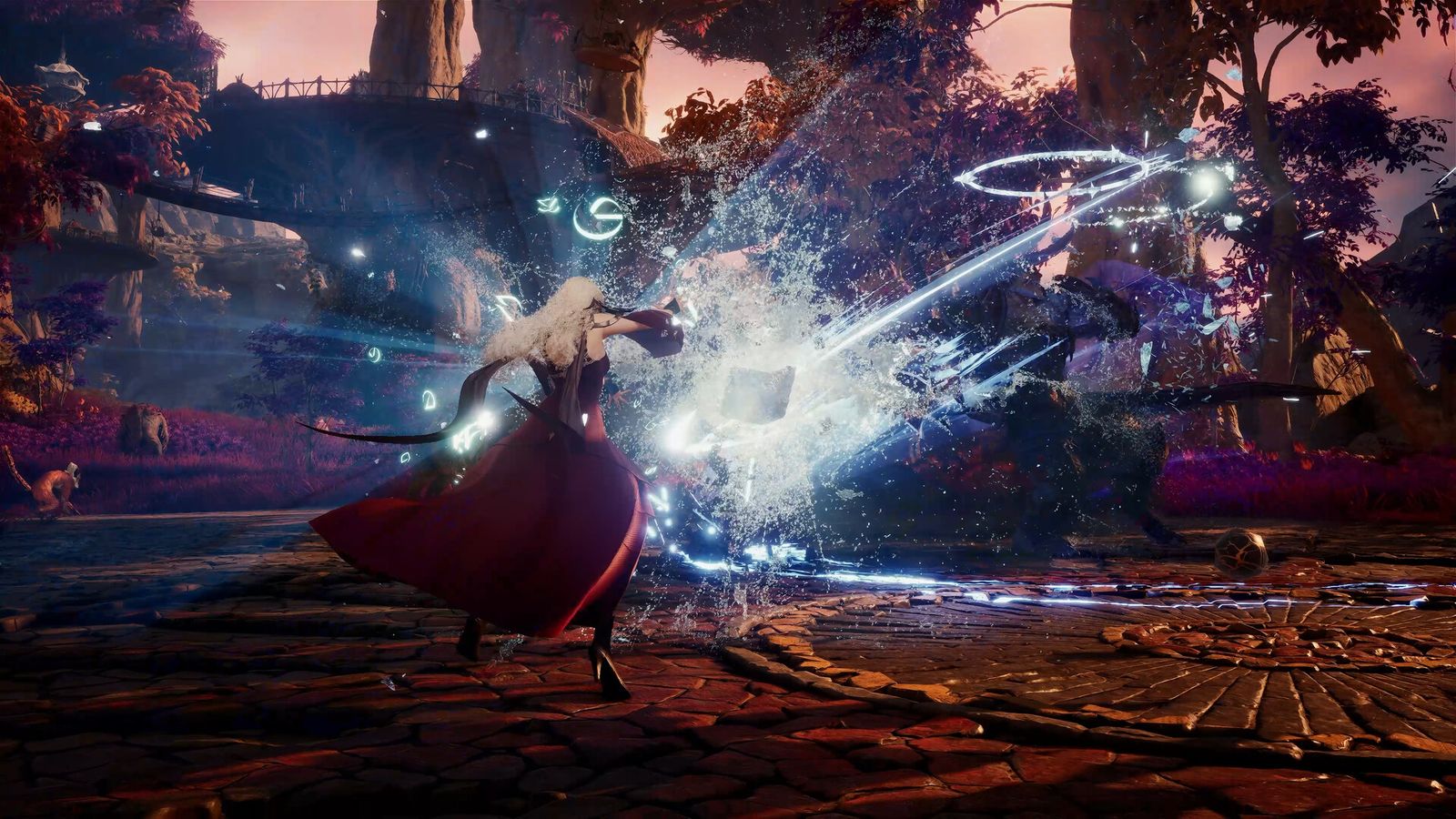 An AION 2 character in a red coat casting a blue spell at an enemy in a ruined courtyard
