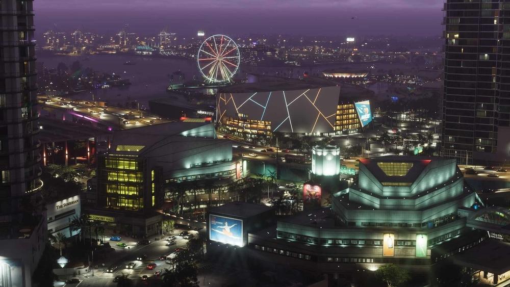 Vice City skyline at night with a Ferris wheel and waterfront buildings in GTA VI