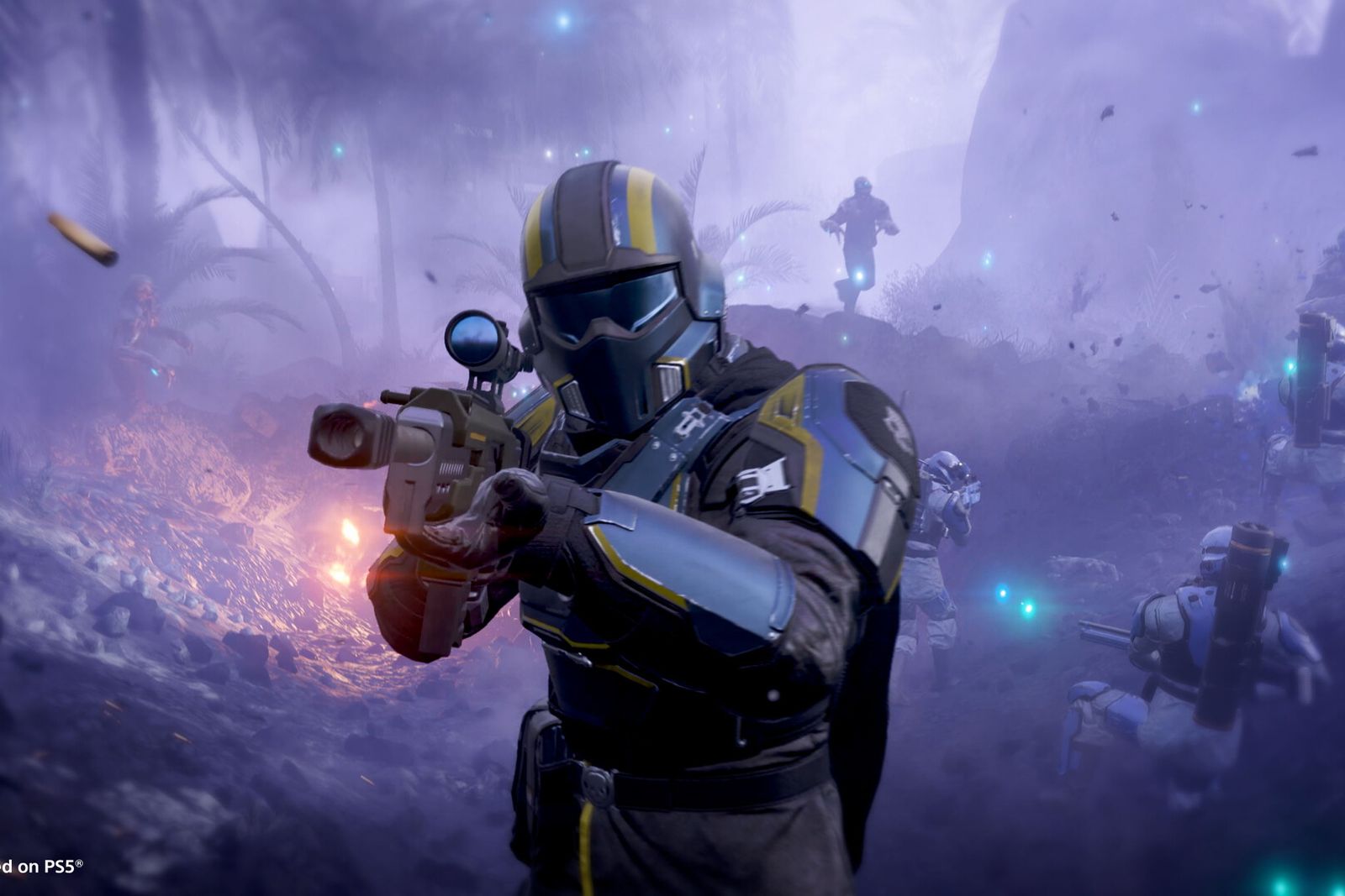 A Helldiver in black and yellow armour aims a rifle through purple fog while squadmates advance behind