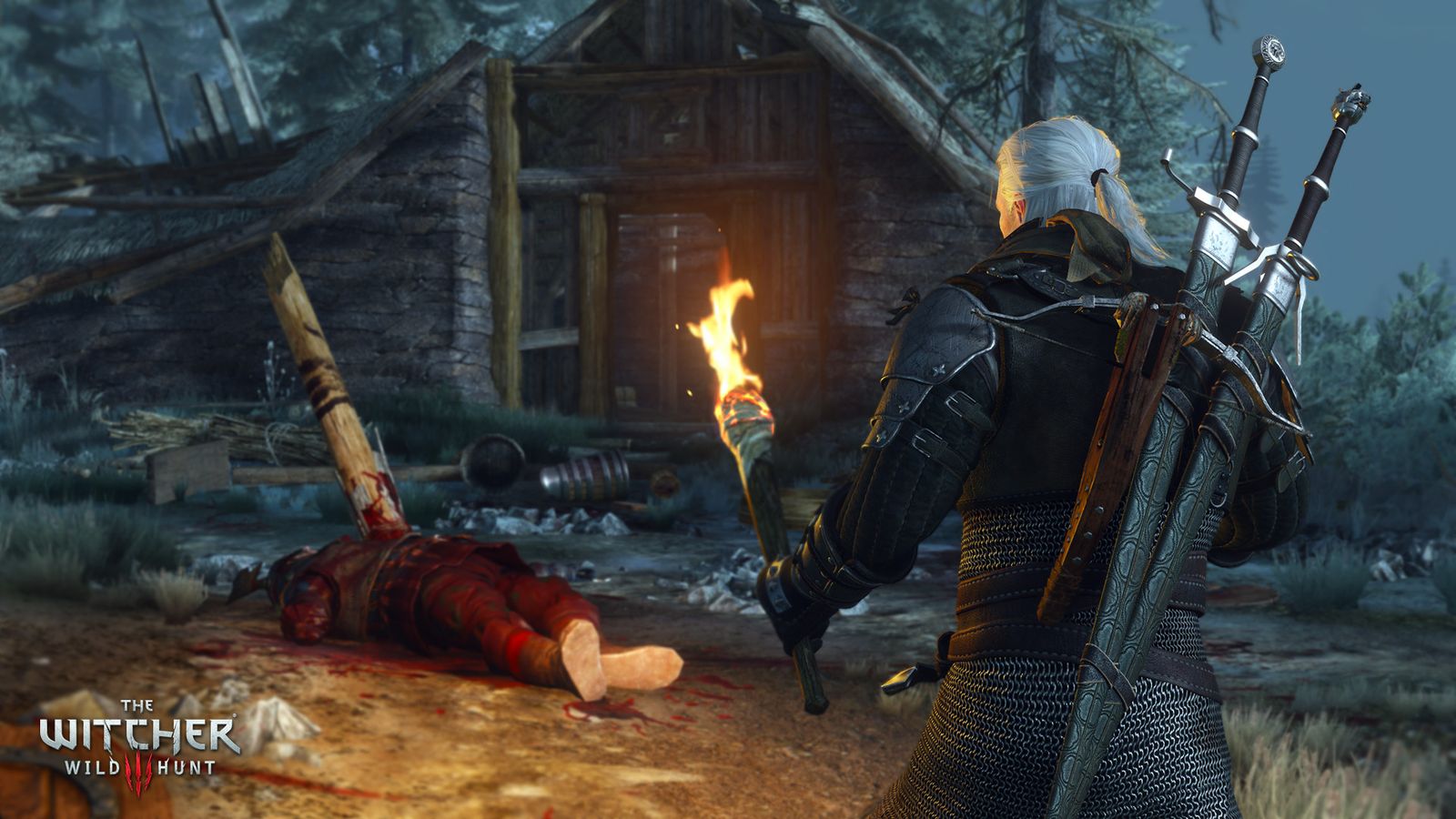 Geralt holding a torch beside a body outside a wooden hut at dusk in The Witcher 3