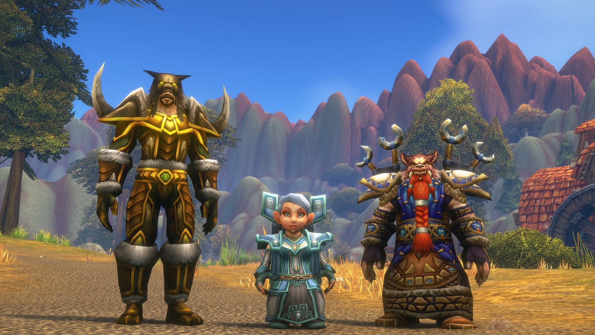 A tauren, a gnome and a dwarf in World of Warcraft: Forever standing on a dirt road in front of red mountains