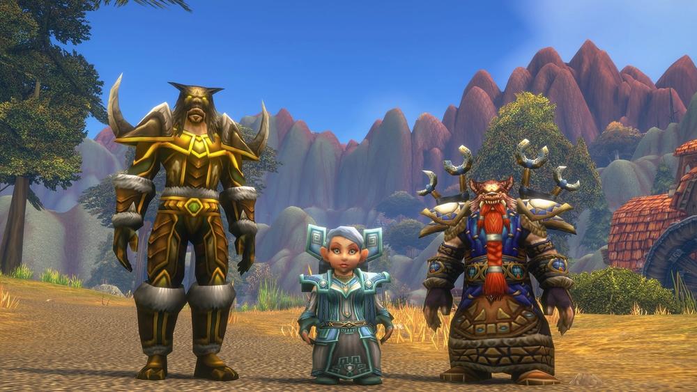 A tauren, a gnome and a dwarf in World of Warcraft: Forever standing on a dirt road in front of red mountains