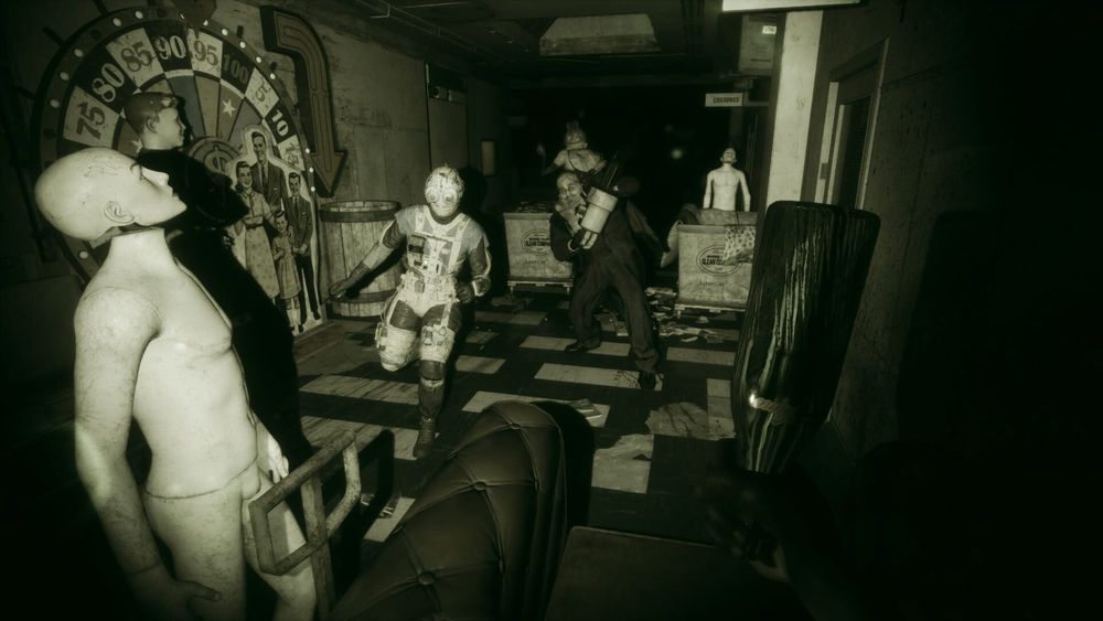 Pale mannequins and masked figures in a dark, green-tinted corridor from The Outlast Trials