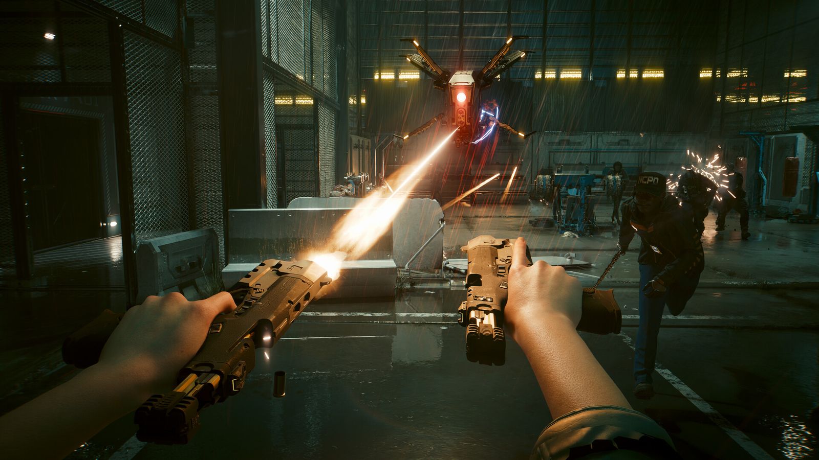 First-person view of V firing two pistols at once inside a warehouse while a drone hovers overhead in Cyberpunk 2077