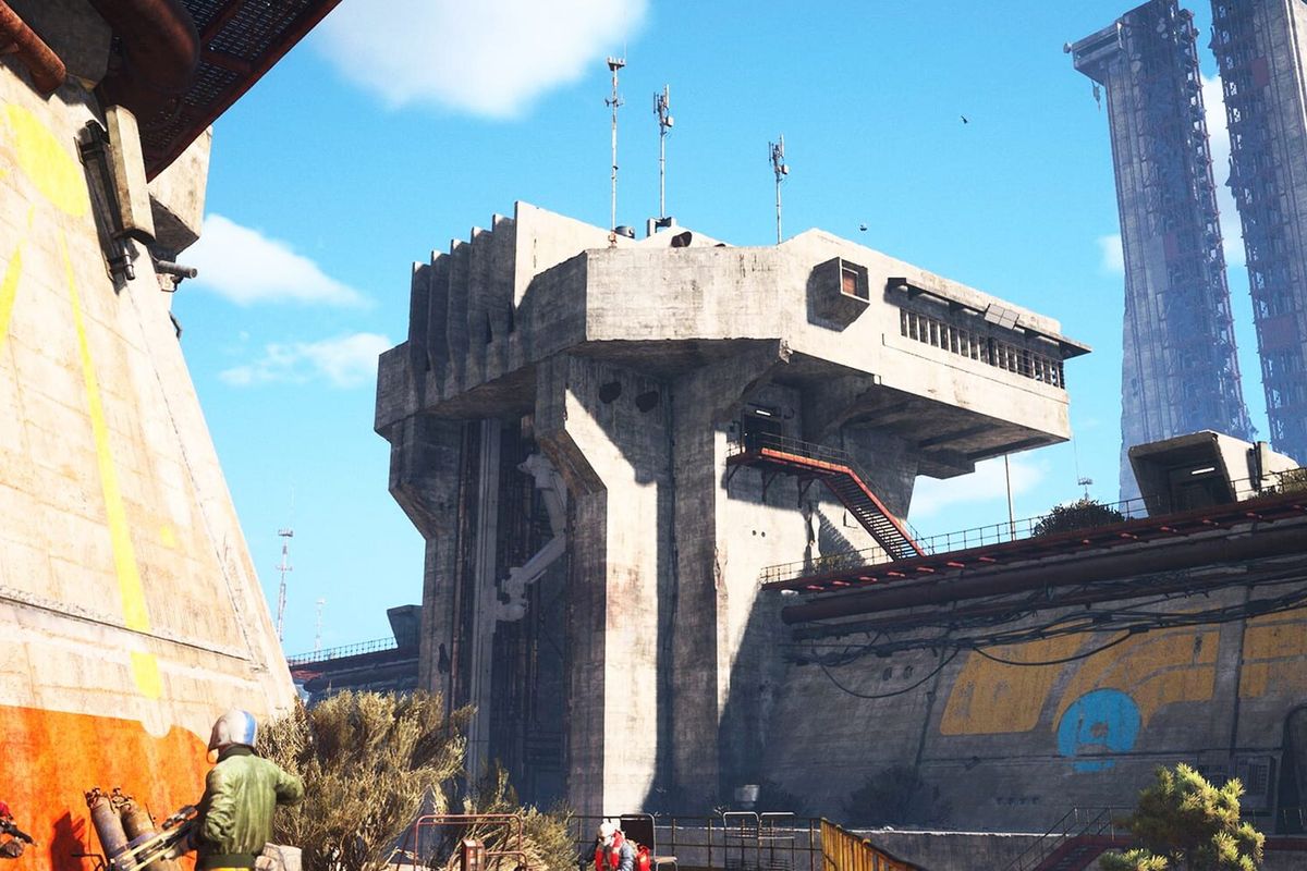 Two ARC Raiders characters with weapons stand at the foot of a weathered concrete tower under a blue sky