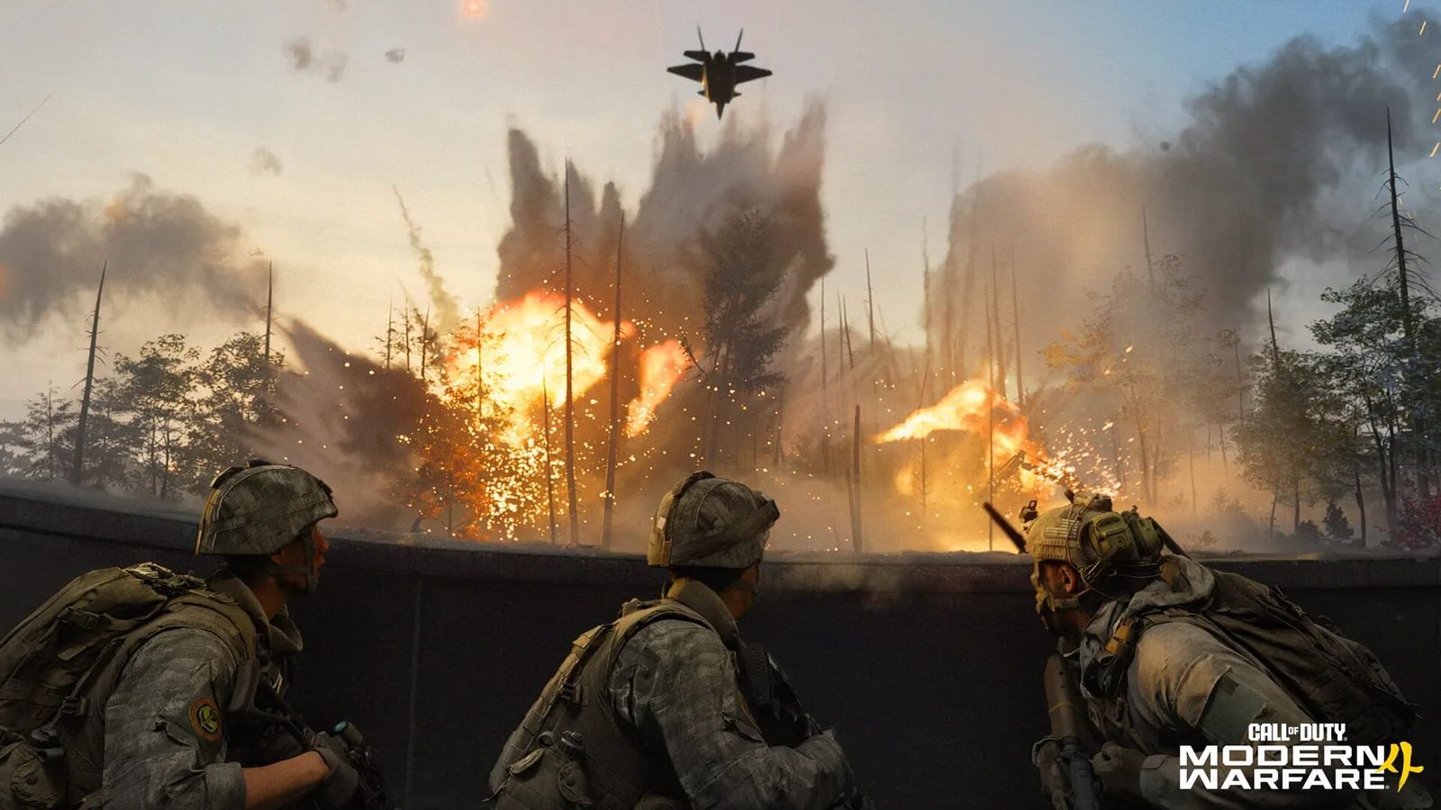 Soldiers take cover behind a wall as explosions and fire light up a forest and a jet flies overhead
