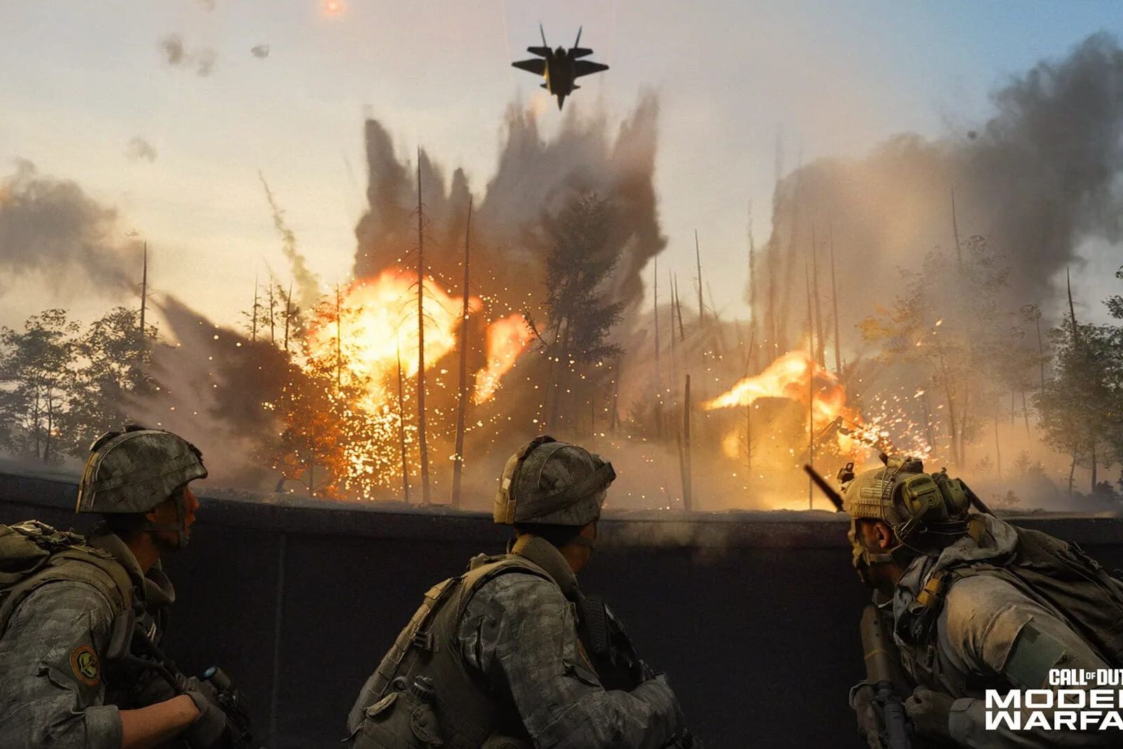 Soldiers take cover behind a wall as explosions and fire light up a forest and a jet flies overhead