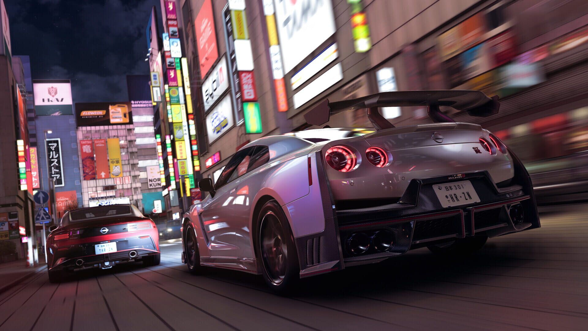 Silver GT-R racing down a neon-lit Tokyo street at night