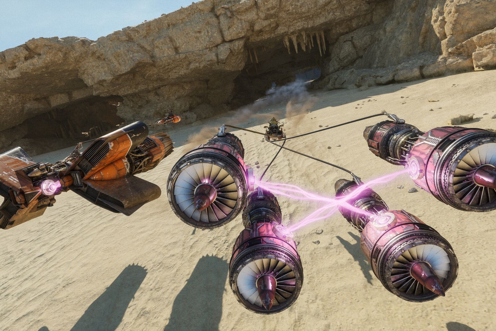 Two podracers with glowing engines race across a sandy canyon