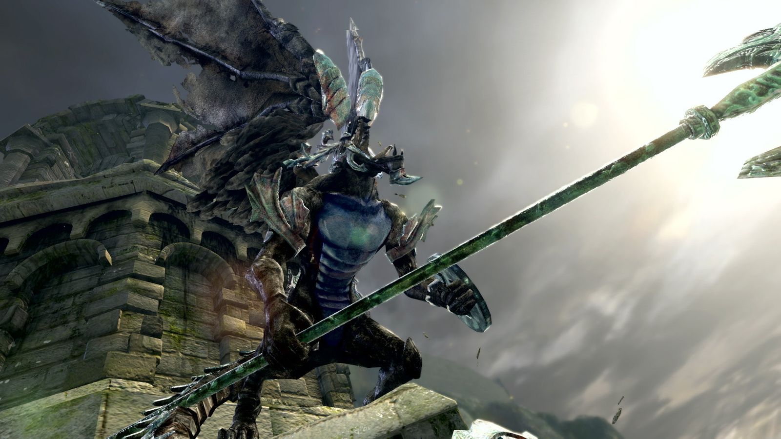 A winged armoured figure holding a long spear on a stone rampart under a grey sky in Dark Souls Remastered