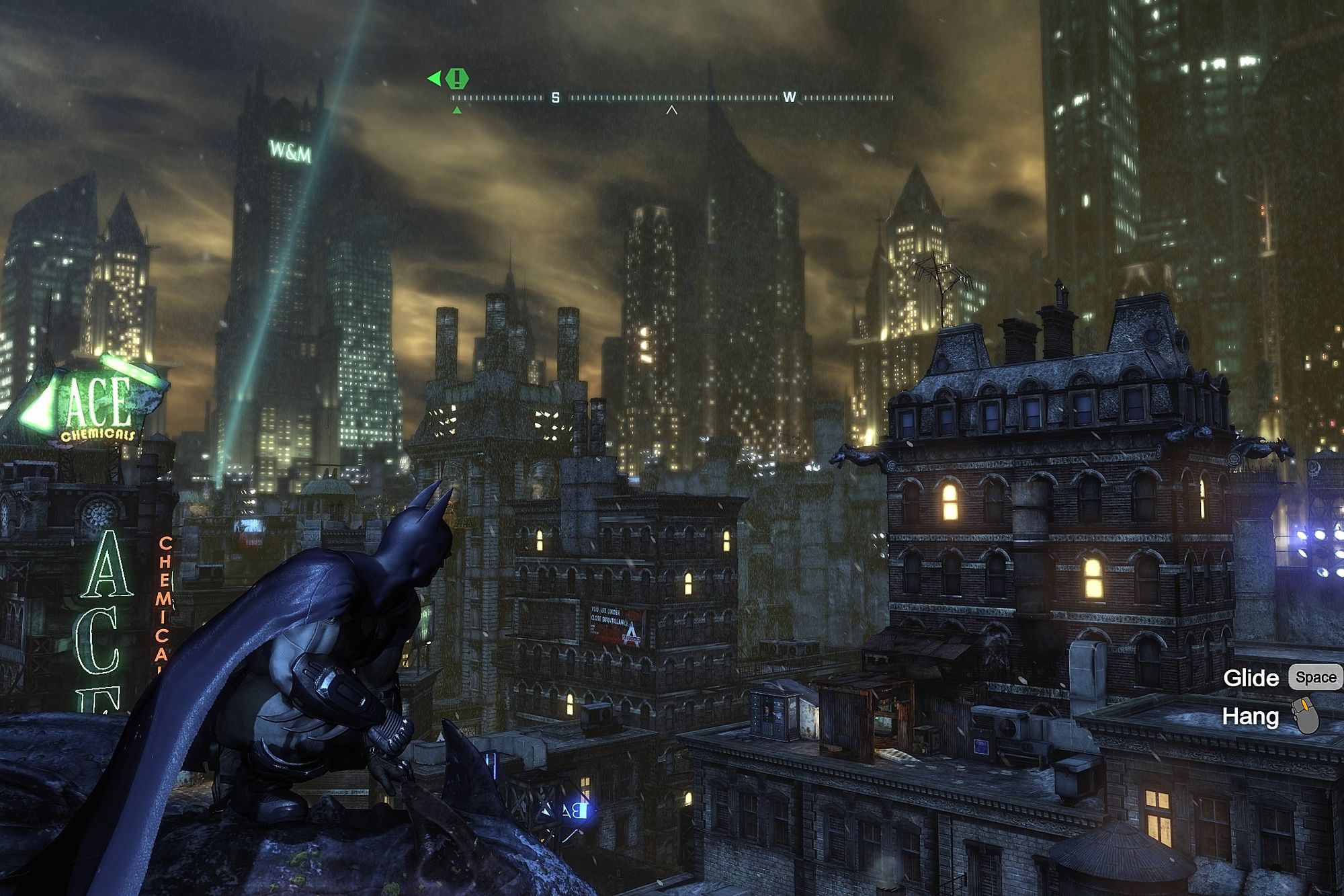 Batman crouched on a rooftop ledge overlooking the lit towers of Arkham City at night