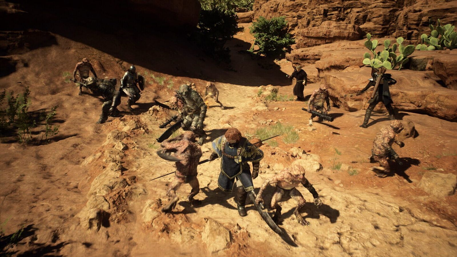 A party of adventurers fights a group of goblins on a sunbaked red rock plateau dotted with cacti
