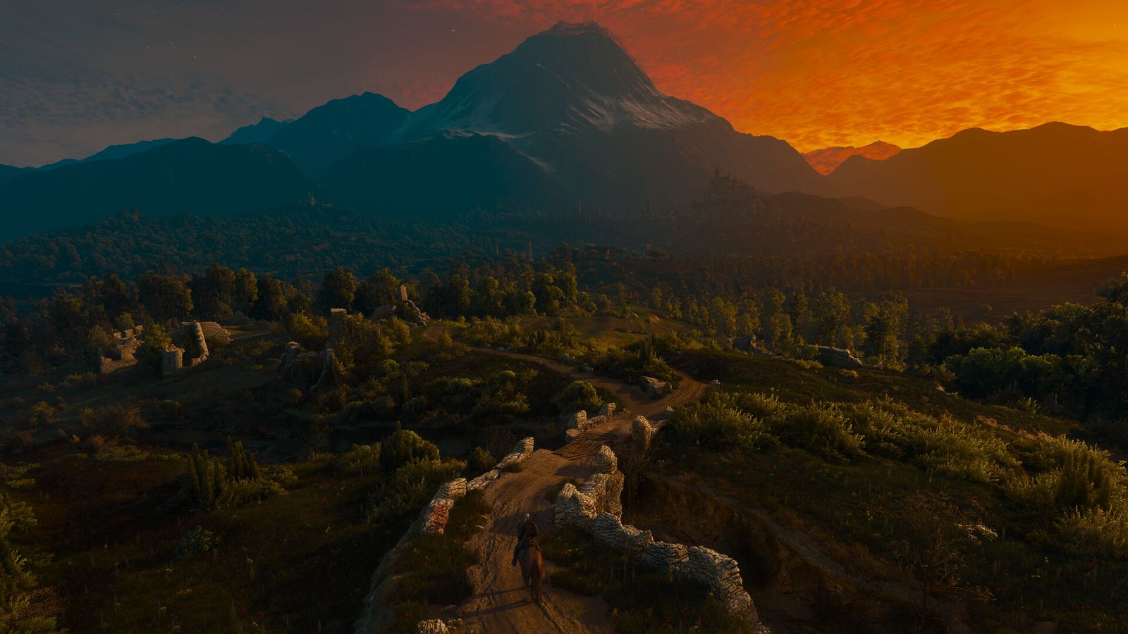 Geralt on horseback riding along a stone path through hills towards a mountain under an orange sunset sky
