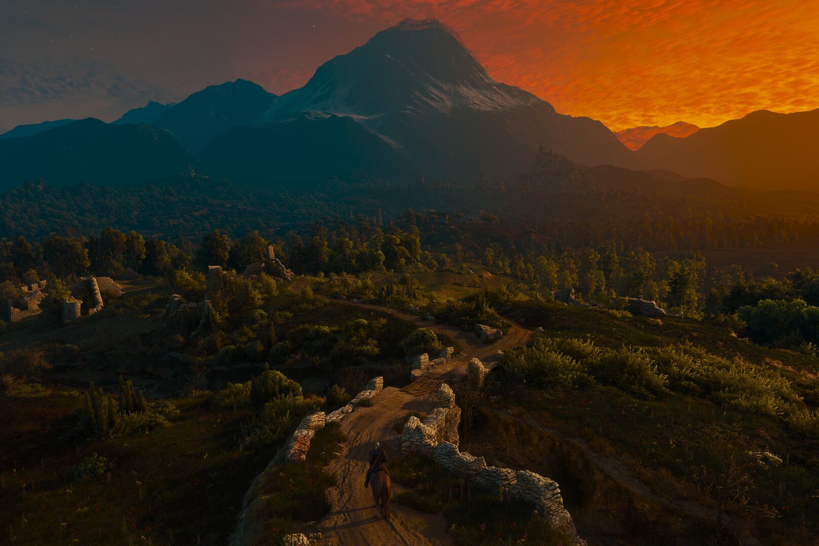 Geralt on horseback riding along a stone path through hills towards a mountain under an orange sunset sky
