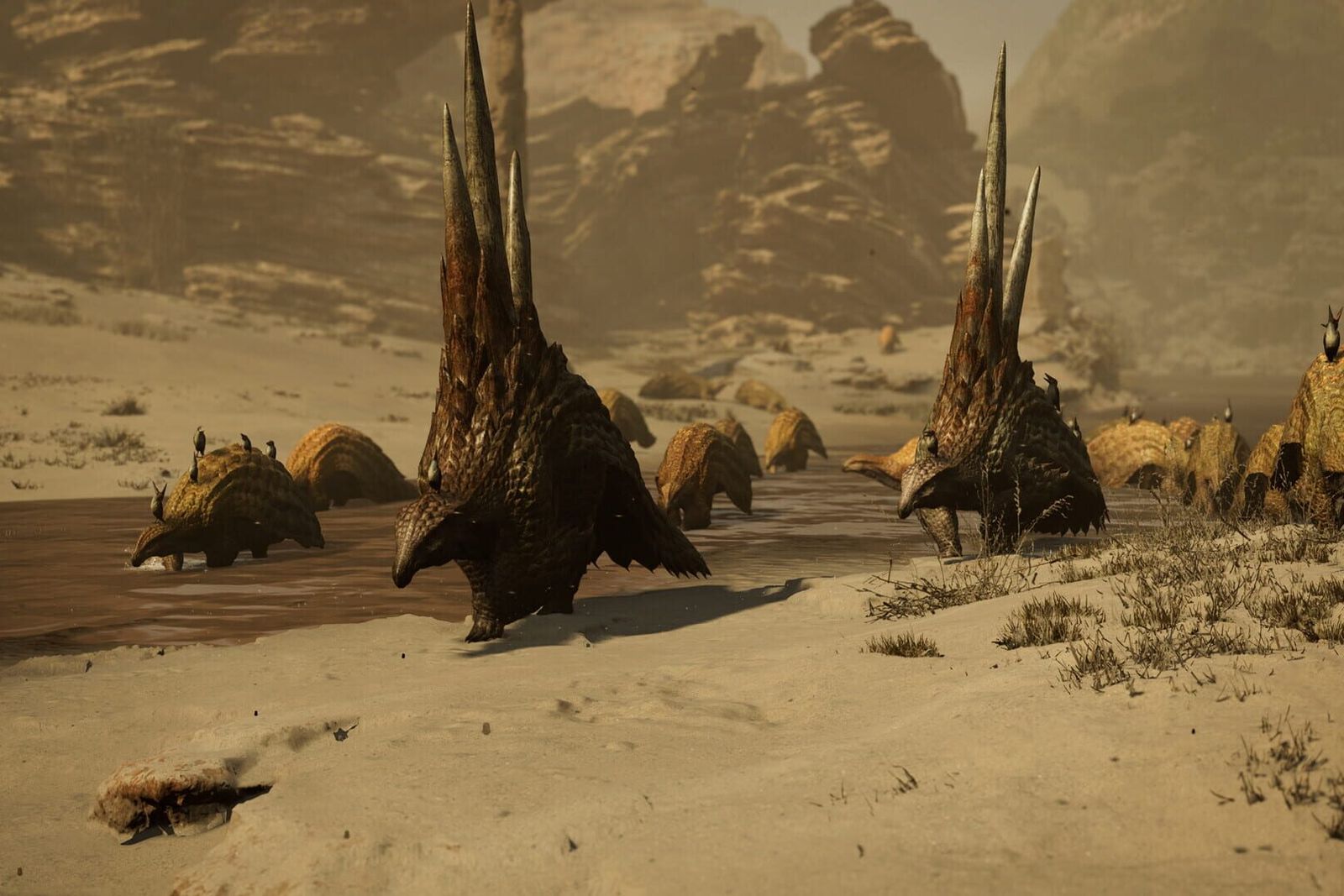 Two spined monsters walking across the sand with their herd behind them