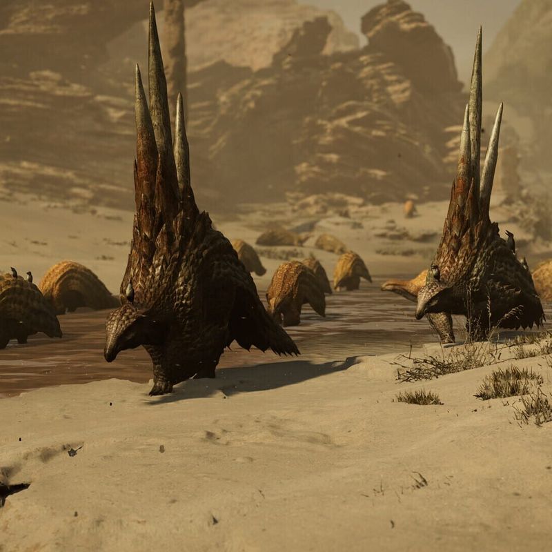 Two spined monsters walking across the sand with their herd behind them