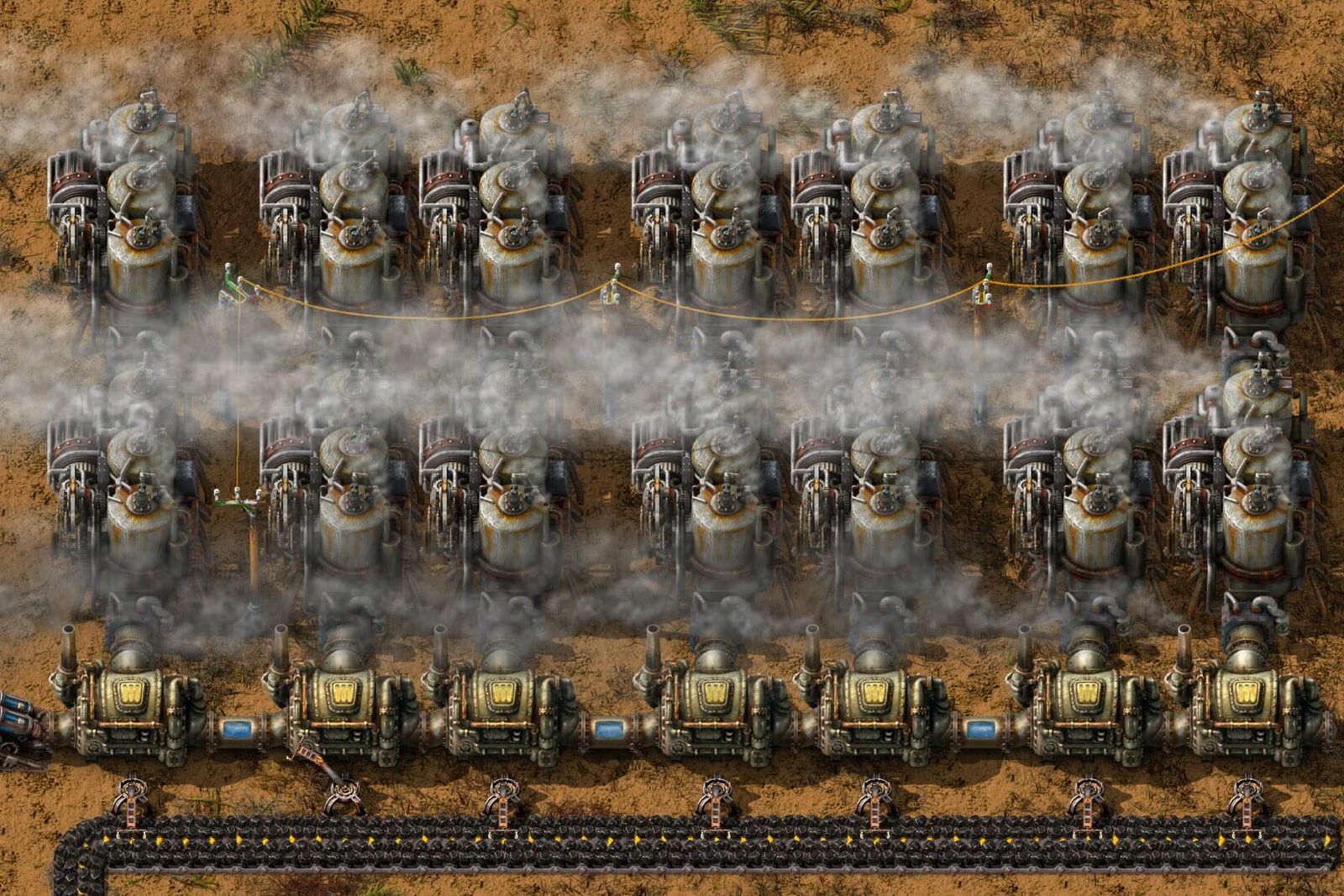 Factorio screenshot of two long rows of steam engines and boilers venting white smoke next to a coastline and a conveyor belt