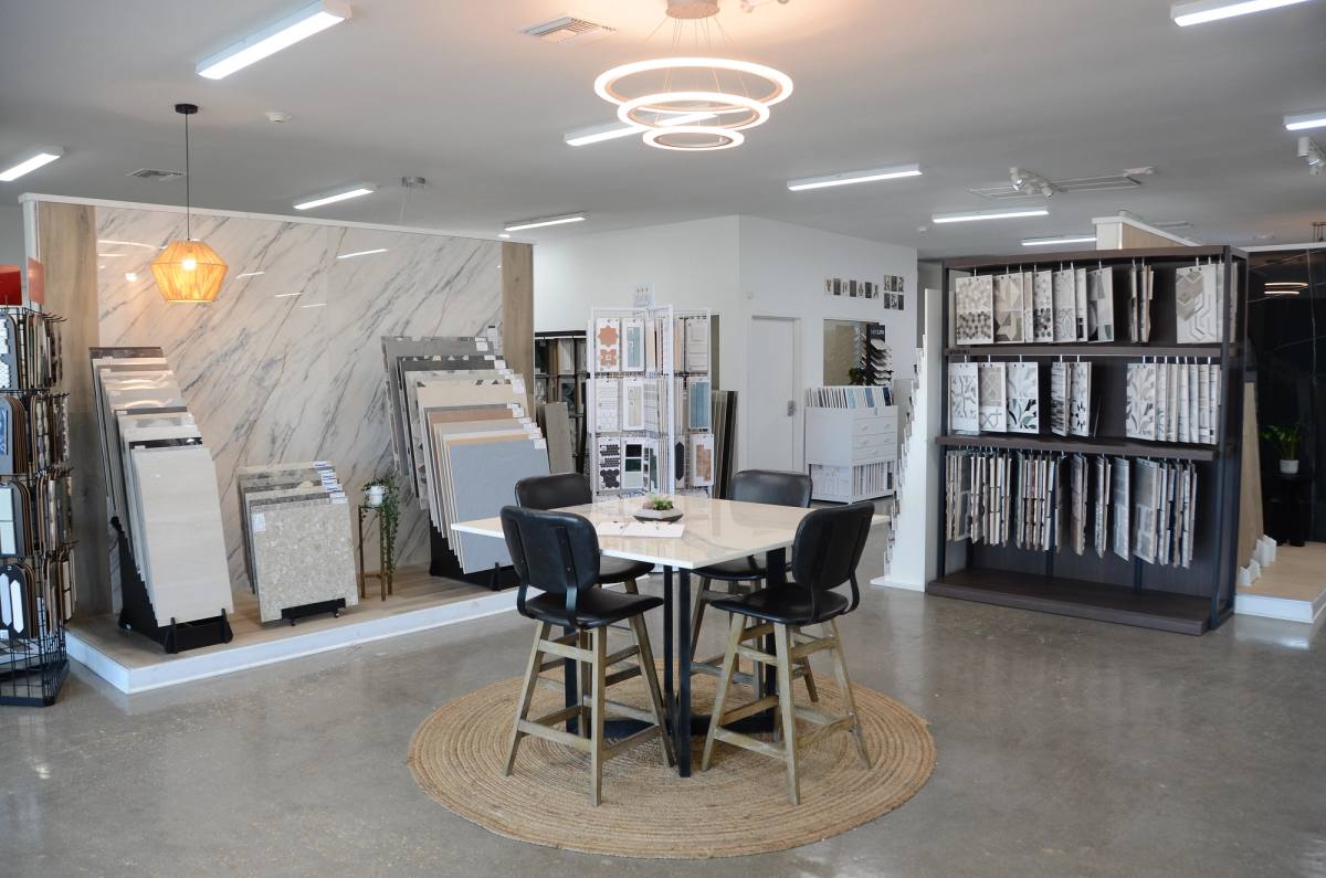 The consultation table at the centre of the showroom, ringed by tile displays