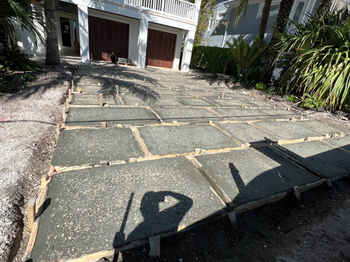A whole driveway of freshly poured Shellcrete panels laid out in timber formwork