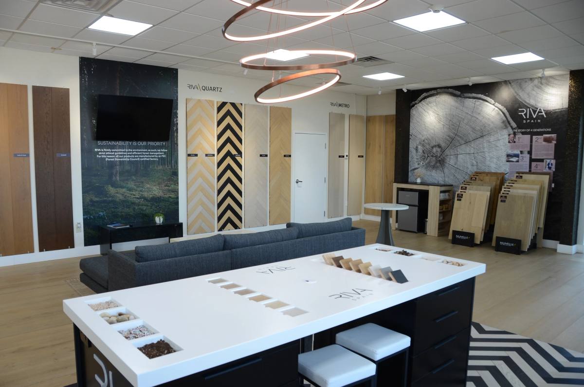 The showroom's design area, with a working sample table and wood plank displays behind it