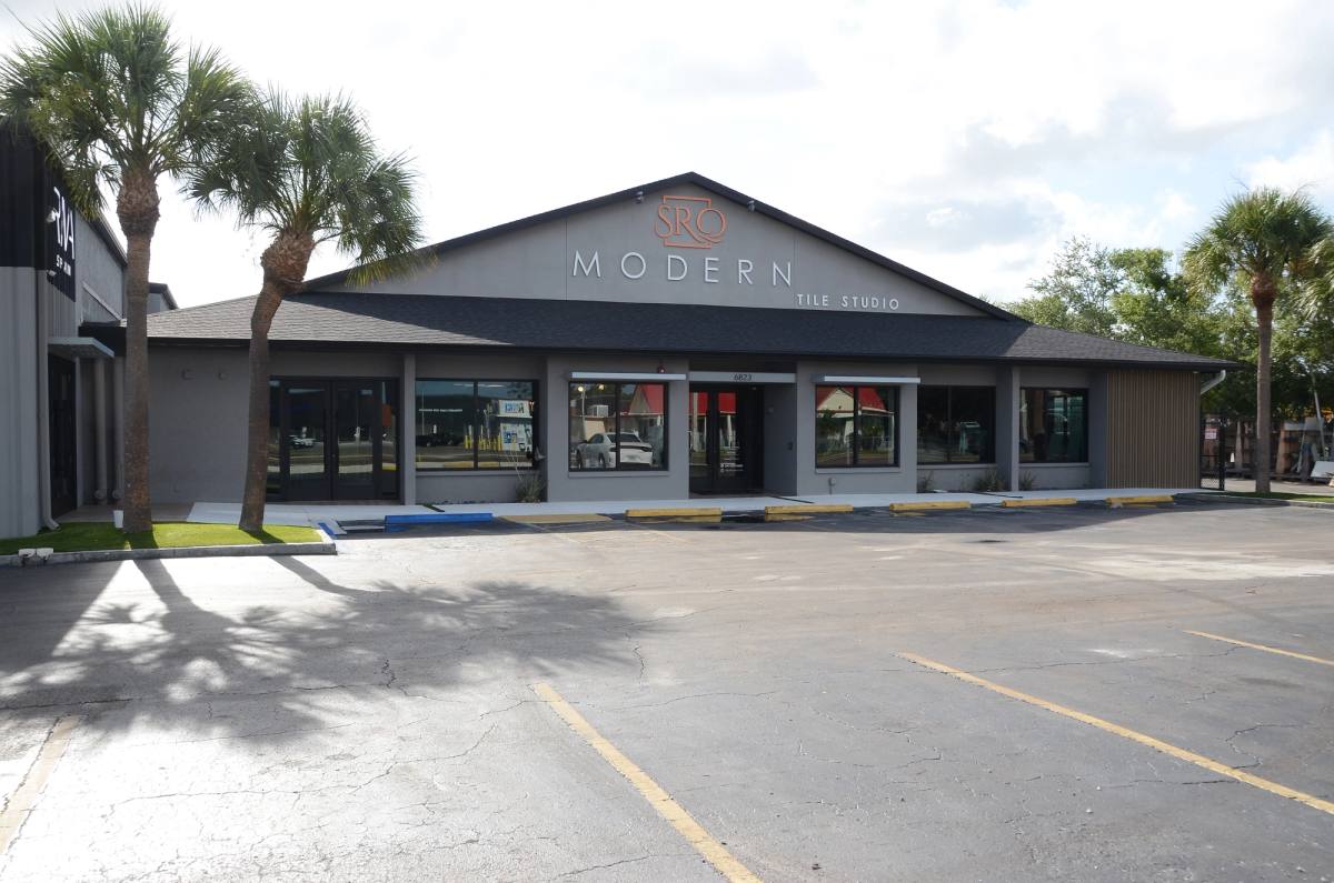 The SRQ Modern building on 14th Street West in Bradenton, palms along the front
