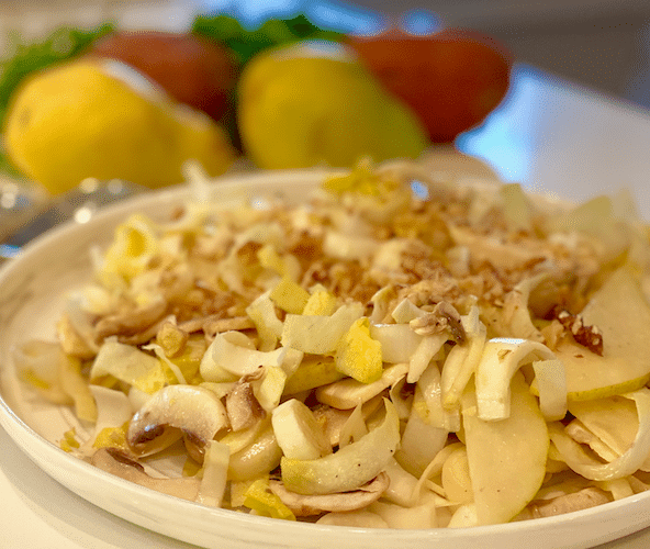 winter endive salad recipe|Winter Endive Salad with Pear and Mushroom on a white plate with fruits as background