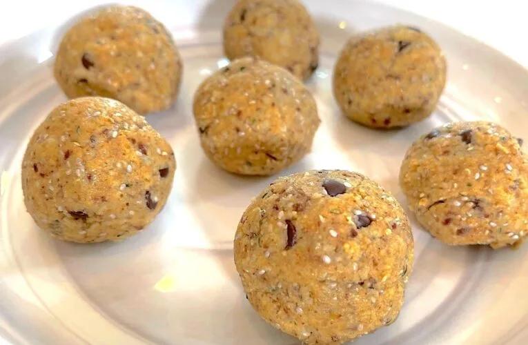 three seed energy balls|White plate with healthy protein balls on white table