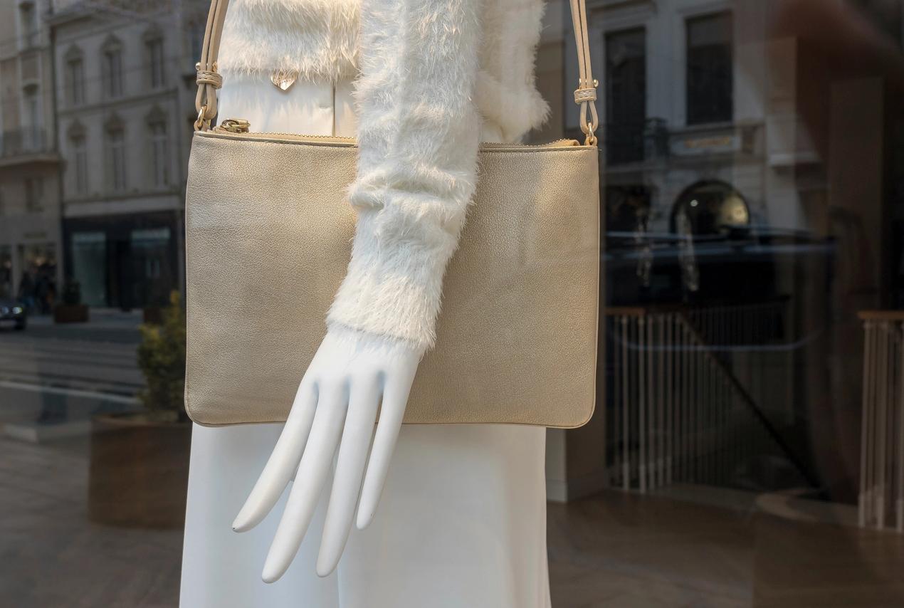 Elegant handbag on mannequin