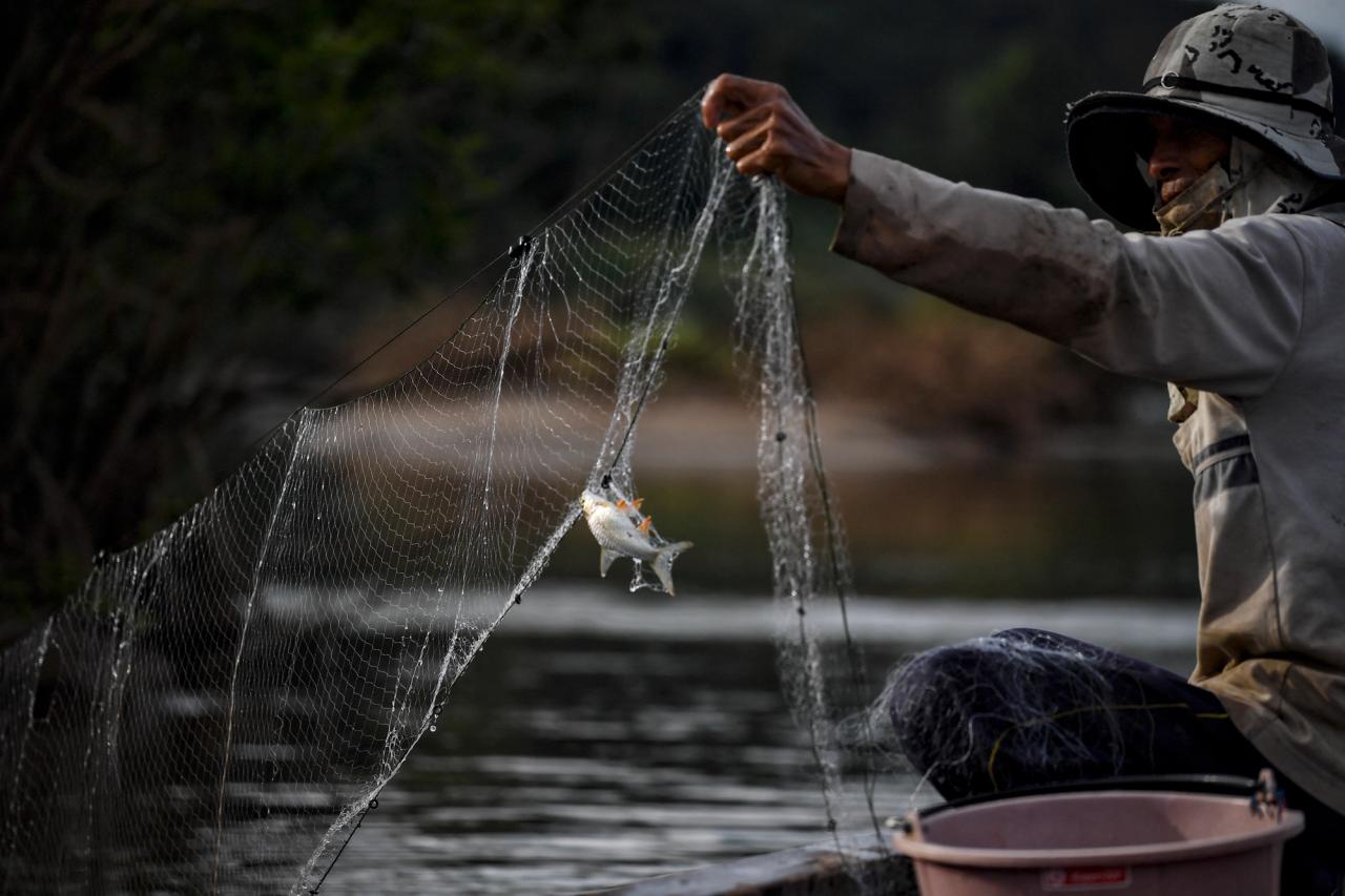 Fisher on the Mekong River, AFP