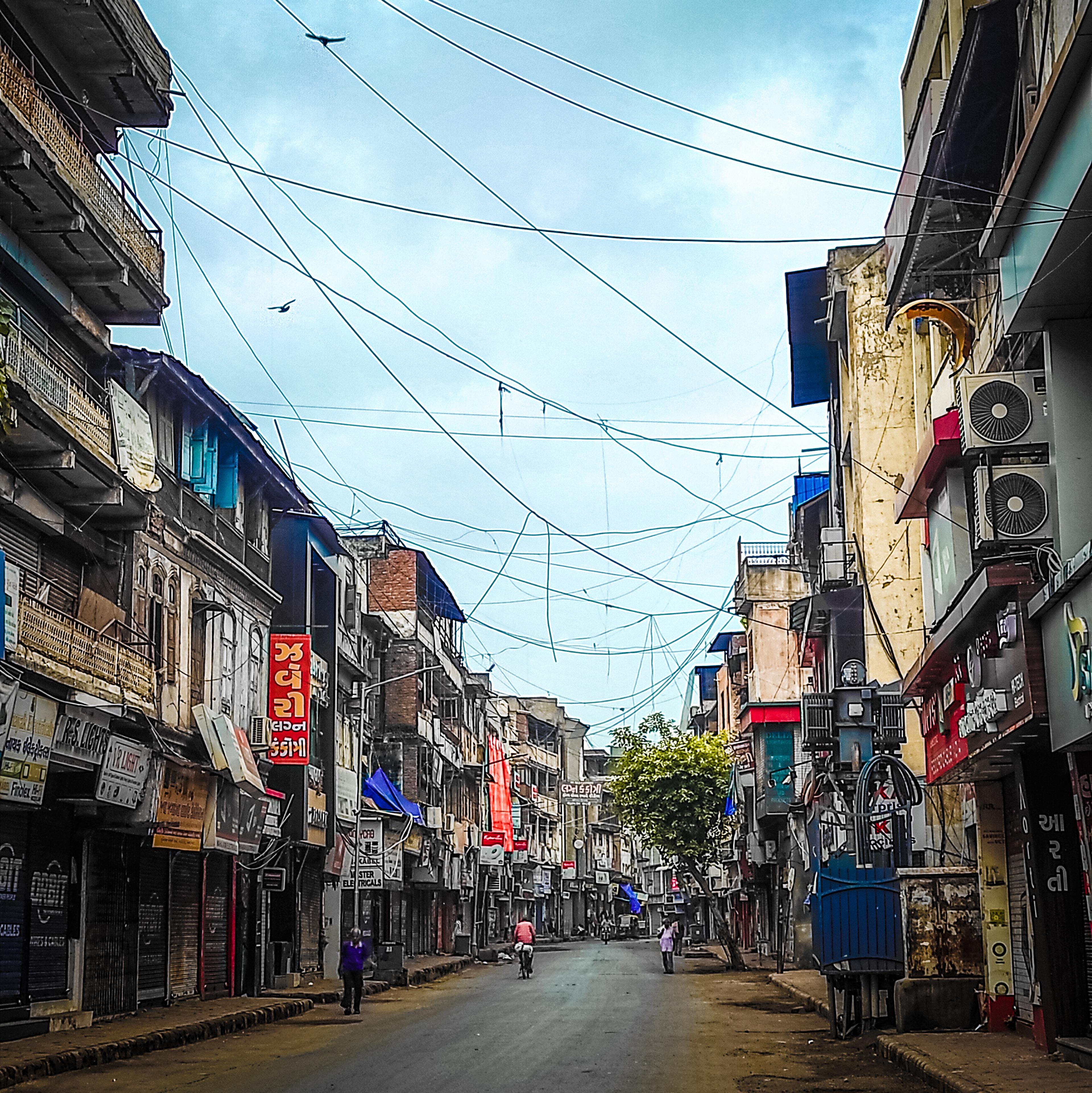 Fabric shops along a lane in Dhalgarwad market, Ahmedabad