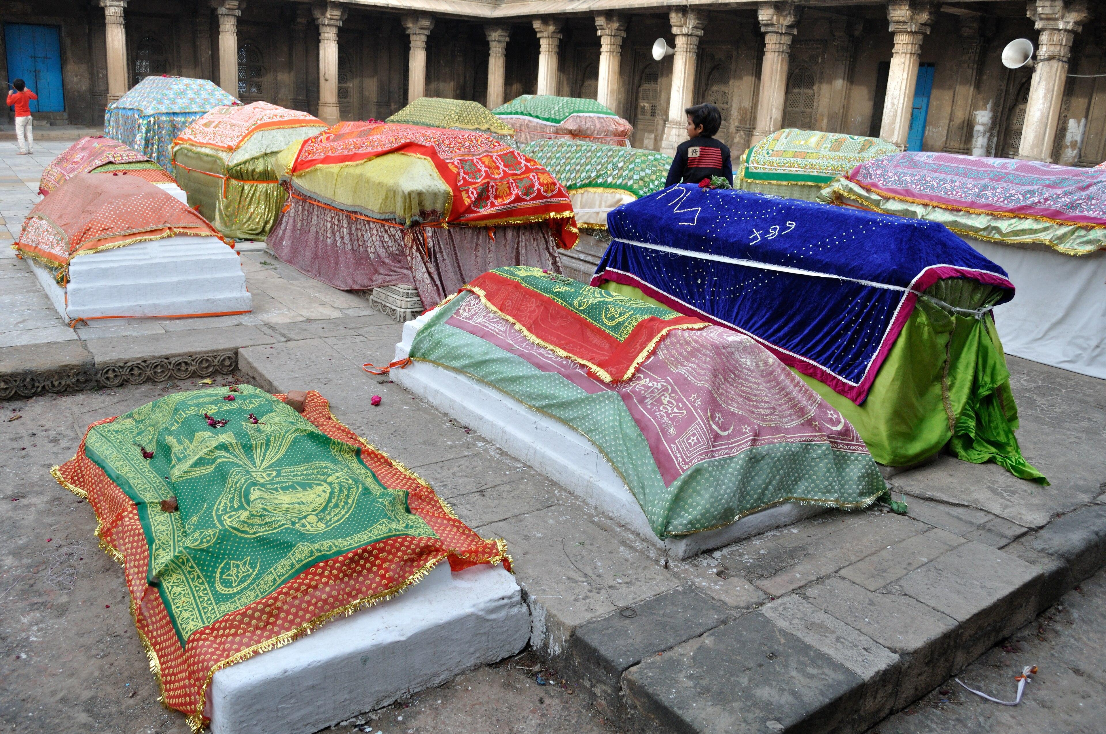 Colourful cloth covers on the queens’ tombs at Rani no Hajiro