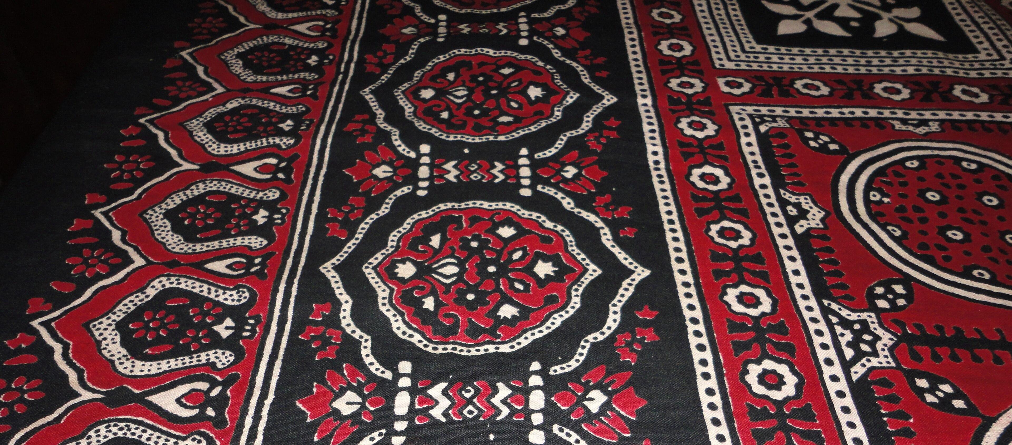 Ajrakh block-printed cloth in deep red, black and white