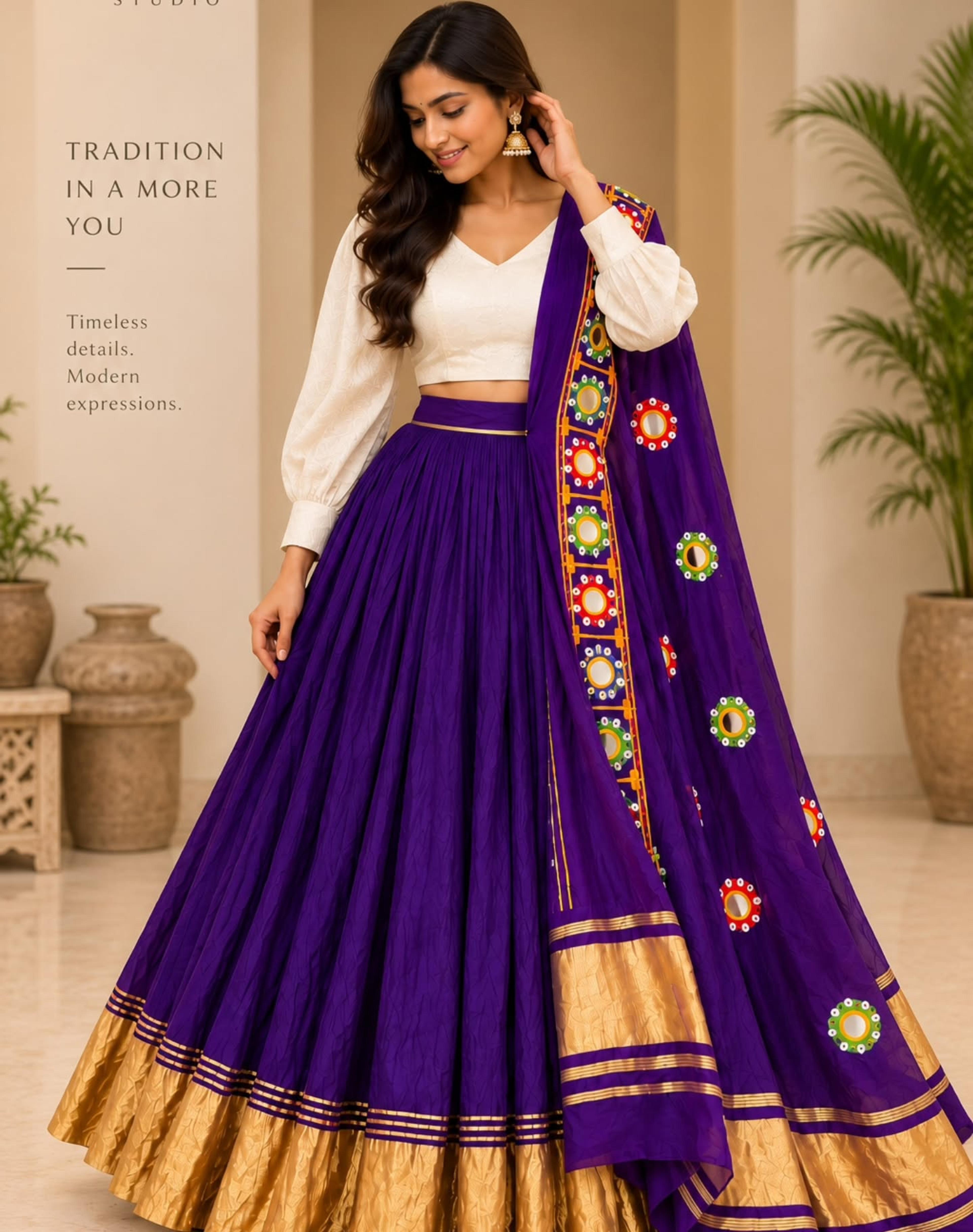 Model in a deep purple lehenga with a gold border, ivory balloon-sleeve blouse and colourful mirror-work dupatta
