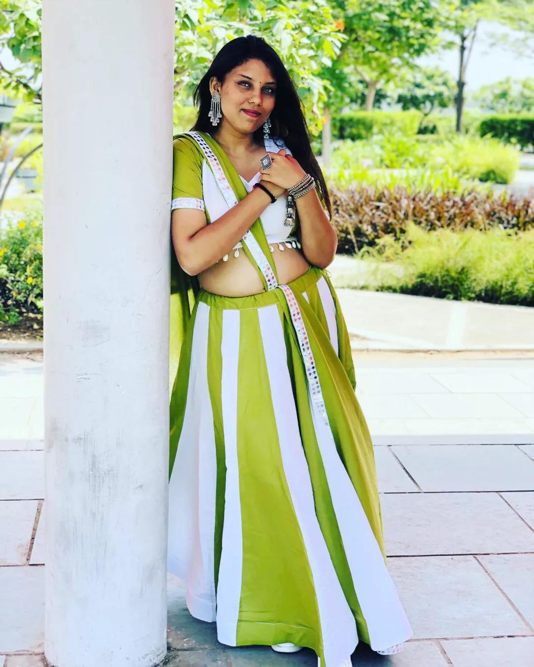 Lime green and white panelled chaniya choli with a mirror-work dupatta border