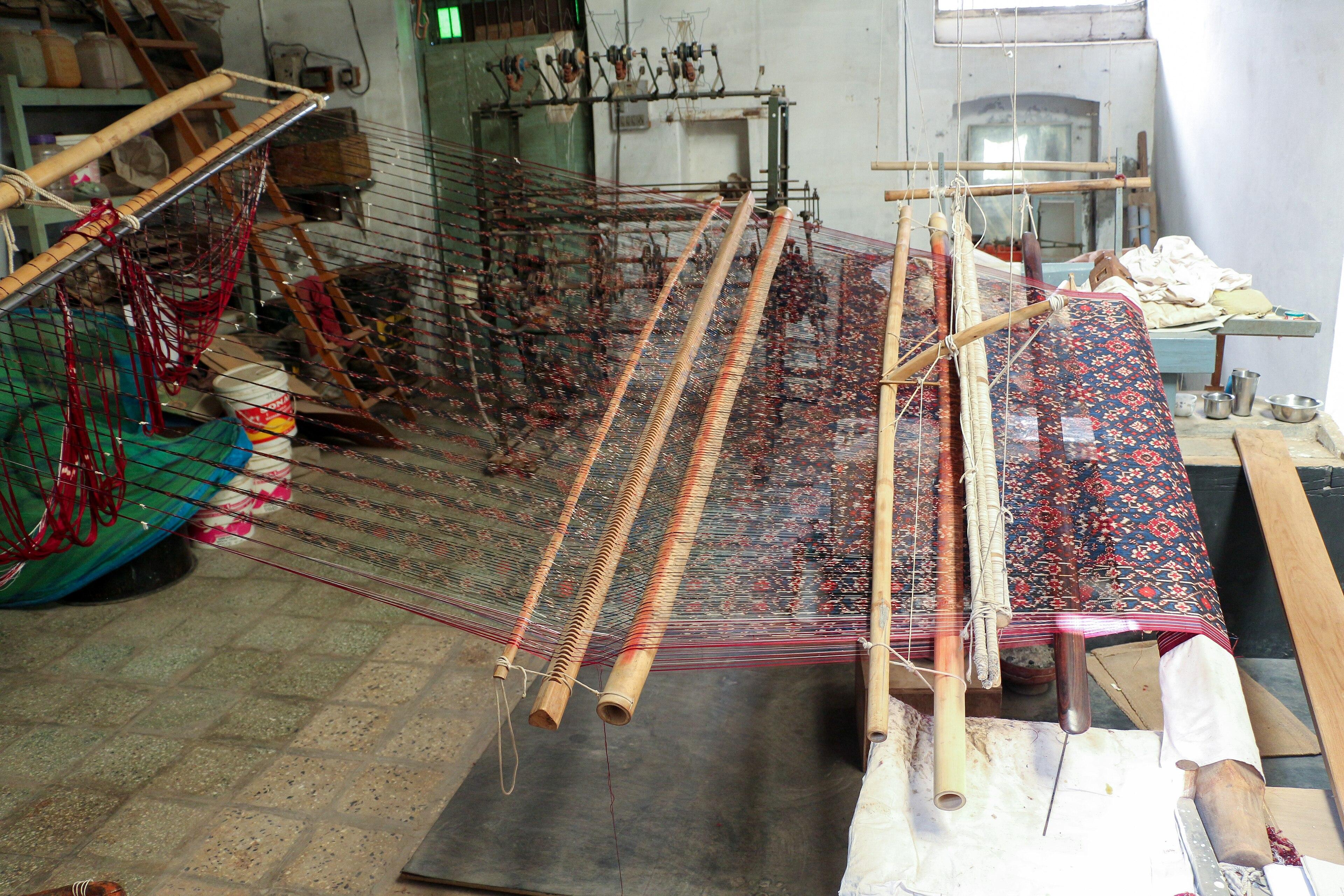 A loom weaving double-ikat patola in Patan