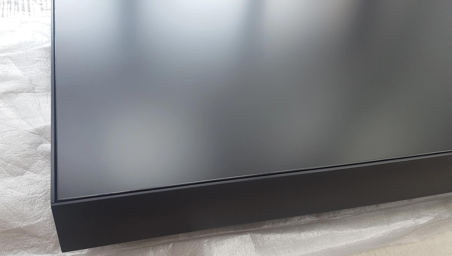 Detail image of corner of bespoke LED screen in black anodised box frame