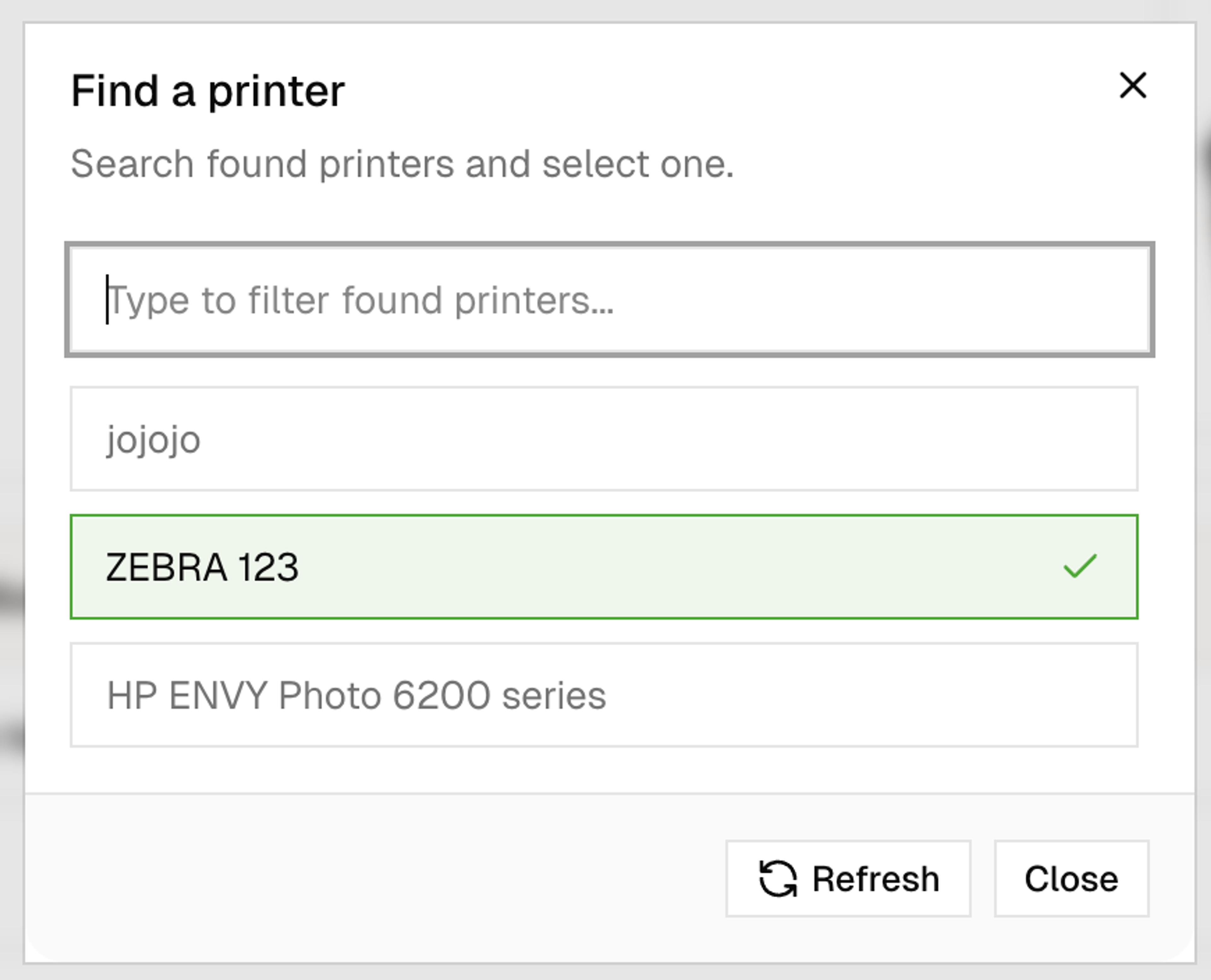 A dialog box titled "Find a printer" with "ZEBRA 123" selected from a list.