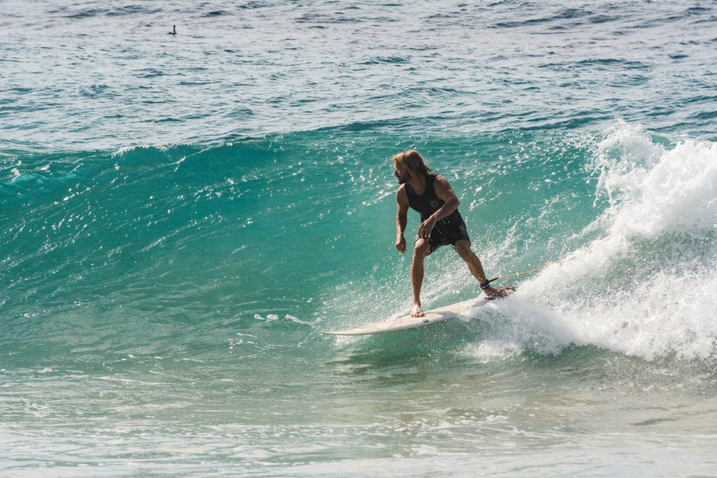 Man Surfing On Body Of Water